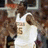 A pixelated image shows a person in white clothing holding an object, with orange text reading "Kevin Durant = Beast" on the right side.