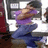 A pixelated image shows a person in a purple shirt and blue pants on the left, with green text on a blue background on the right.