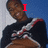 A person in a dark sweater with white and red stripes on the sleeves appears across four , each displaying different text overlays