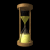 Animated hourglass with yellow sand flowing through a wooden frame against black background.