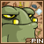 Green cartoon character with yellow eyes and square nose, holding a blue object against stone background; text 'SPIN' below.