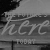Animated sequence showing the phrase 'THE FUTURE'S HERE TODAY' forming letter by letter with a grayscale background of clouds and buildings.