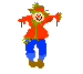 Pixelated scarecrow in red jacket and blue pants with white gloves, holding green stalks, smiling face on gray background.