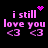 Pixelated pink text 'i still love you' with two '<3' symbols on black background, animated heart and starburst effects above.