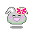 Pixelated bunny head with pink bow, green outline, and smiling expression showing pink mouth and cheeks.