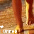 A static image shows a person's legs in brown boots standing on a wooden surface with the word 'SUMMER' repeated across multiple