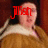 Pixelated image of a person with light skin wearing brown clothing, overlaid with red text reading 'Jash' in the upper left.