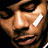 Pixelated close-up of a person's face with visible facial features and lighting effects on skin tones.