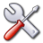 Pixelated wrench and screwdriver crossed on gray background with red handle, rendered in low-resolution style.