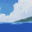 Pixelated character with brown hair and blue eyes appears in multiple expressions against a sky background, transitioning from clouds to water.