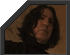 Two adjacent pixelated portraits in dark gray frames with angled top edges, one showing a person with long dark hair and the other a person with short light hair against warm-toned backgrounds.