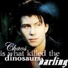 A static image shows a person with dark hair and a black jacket against a dark background with text overlay.