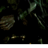 Animated sequence of a green-haired figure in dark clothing holding a staff, transitioning from a close-up to a full-body view with glowing effects.