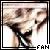 Pixelated static image of a person in dark clothing with arms raised, framed by black border and pixelated text 'FAN' at bottom right.