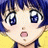 A pixelated anime-style character with blue hair and large eyes on the left, next to a black background with white text reading "Anime IM" and "COM" on the right.