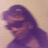 A person with long dark hair and sunglasses appears in four , showing slight head movement across frames