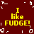A static image with a dark red background displays four identical yellow text blocks reading "I like FUDGE!" arranged in a , surrounded by scattered white pixel fragments