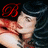 Pixelated image of a person with light skin and dark hair, red symbol above head, blurred background.