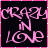 Pink cursive text 'CRAZY IN LOVE' on black background with pink border, displayed in a