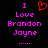 Pixelated text and symbols on black background: 'I' in pink, red heart symbol above 'Love', followed by 'Brandon Jayne' in pink with ellipsis below.