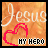 A static icon with orange textured background, white 'Jesus' text at top, red heart outline below it, and black 'MY HERO' text beneath the heart.