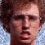 A static image featuring a person with light brown hair against a blurred background, accompanied by red text reading 'my hero' on black.