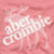 Pink background with white text and three distinct text overlays in different colors.