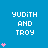 Blue background with white text 'YUDITH AND TROY' and varying pink heart counts per