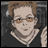Pixelated image of a person with light brown hair and glasses, wearing a dark top and multiple necklaces, next to text reading 'AnimeIM' and 'com' on a black background.