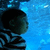 Two side-by-side show a child in striped clothing against a blue background, with the right cropped to exclude part of the scene