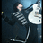 A pixelated image shows a person in dark clothing holding a white guitar against a dark background, with pink text reading "i LOVE Fank lero!!" on the right.
