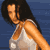 Pixelated static image of a person in a white bikini top against a blue background with visible dithering and blocky rendering artifacts.