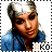 A pixelated image of a person with short silver hair wearing a blue top, with text 'AKO' visible below.