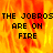 Pixelated text 'THE JOBROS ARE ON FIRE' on a fiery orange-yellow background with visible pixelation and partial gray overlay.