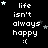Black background with white pixelated text 'life isn't always happy :(' and scattered white and gray stars, some stars animate to change position.