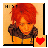 A static contact sheet of two identical AIM buddy icon frames showing a person with red hair and a brown hoodie, each with a small red heart symbol in the bottom-right corner.