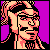 Pixelated 50x50 static buddy icon featuring a stylized character with peach skin, black hair, and glasses against a solid purple background.