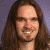 four pixelated images showing a person with long brown hair in various poses and backgrounds, including one with blue text reading "Go Bo!!"