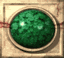 Two identical circular green gem-like objects in beige frames with red horizontal lines, side-by-side on a light background.