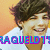 A pixelated image of a person with short brown hair wearing a white shirt against an orange background, displaying text that changes from "RAQUELDT" to "CRUSH".