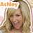 A pixelated image of a smiling woman with long blonde hair, featuring the name 'Ashley' in orange text above her head.