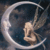 Pixelated static icon featuring a light-colored fairy-like figure inside a crescent moon shape against dark background.