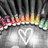 A static icon with a heart symbol on a metallic surface, bordered by a colorful floral pattern and dark vertical stripes.