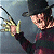 Pixelated figure in dark clothing and hat extends arm with yellow-gloved hand, emitting black and yellow energy lines against a gray background.