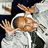 Pixelated image of a person in white clothing with arms raised, next to black text reading 'Get like chris' on a white background.