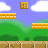 Pixelated character in red cap and yellow shirt moves across brown brick platform with green hills, clouds, and orange blocks against blue sky.