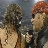 Two pixelated figures in close proximity, one with dark hair and the other with reddish-brown hair, against a muted background.