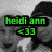 Black-and-white photo of two people wearing hats with green text overlay reading 'heidi ann <33' in the top-left corner.