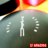 A small animated icon shows a white stick figure dancing on a dark green oval background with a red and orange gradient border, while red text reads 'IS AMAZING' at the bottom.