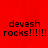 Red background with black text reading "devesh rocks!!!!!" in three identical sections, one section partially obscured by a gray rectangle.